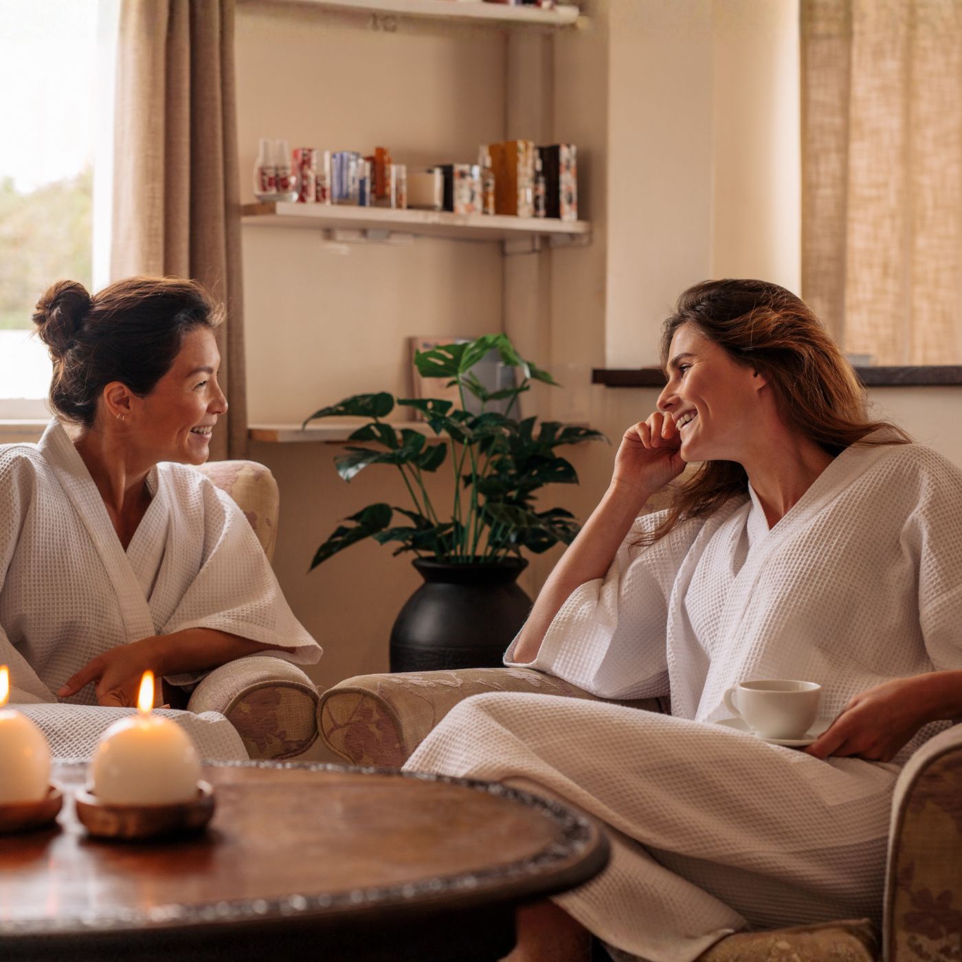 Two women in a quiet, cozy Stannington setting, emphasizing peaceful, intentional friendships formed after 40.