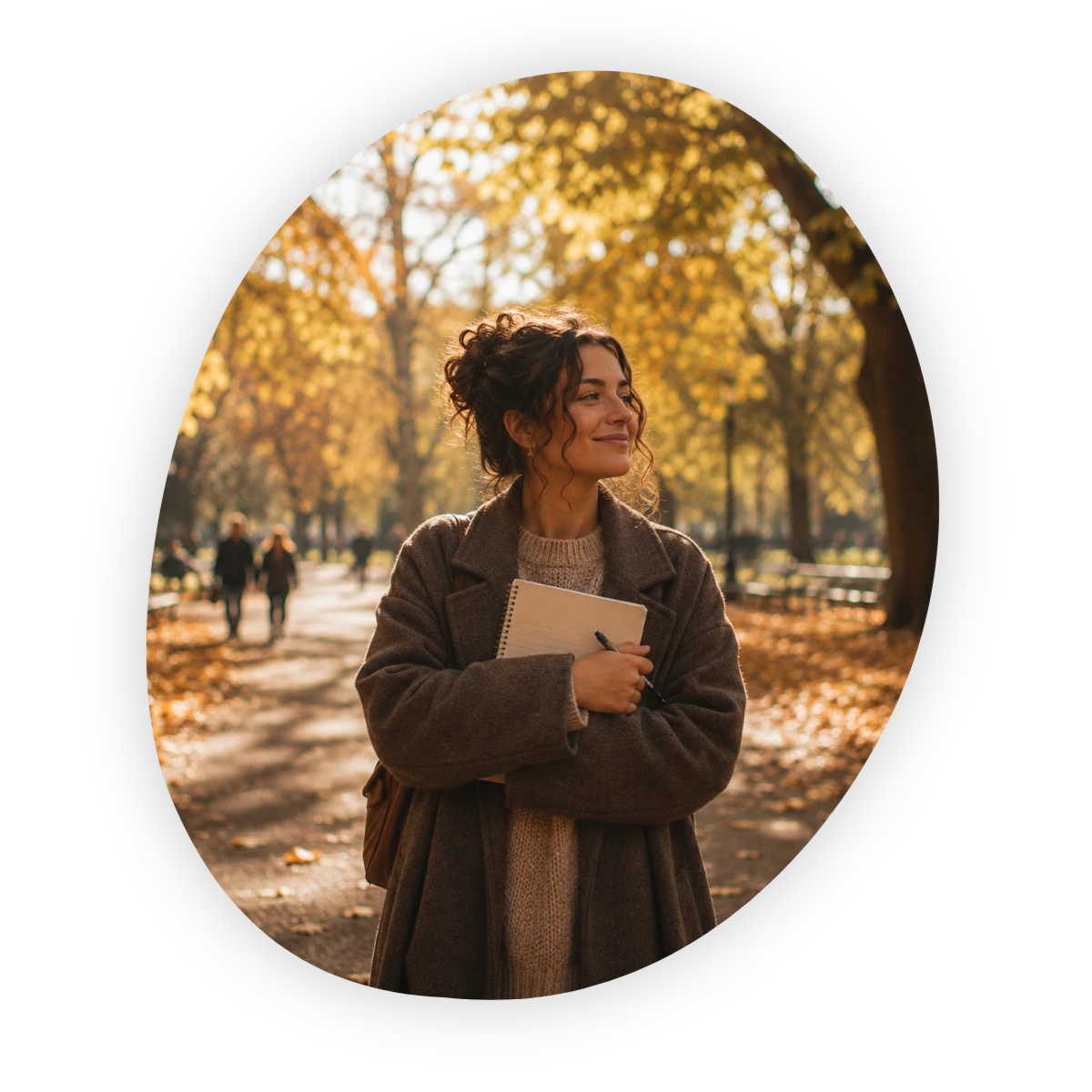 September reset: woman holding a notebook during an autumn walk in the park.
